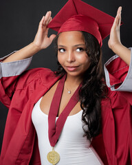 Young African-American Teen Woman Graduation Cap and Gown