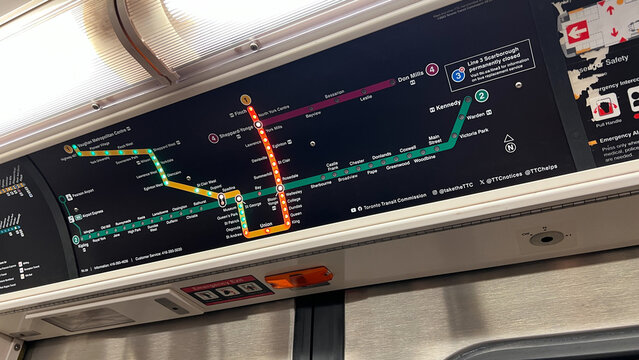 Toronto, Canada - June 29, 2025: Subway TTC transit map displayed inside a train car, showcasing various routes and stations, illustrating urban transportation navigation and connectivity