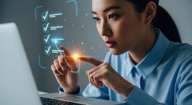 Young asian woman interacts with a glowing digital checklist on a futuristic interface while using a laptop