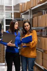 Asian staff members checking parcels at a startup fulfillment center. Local delivery and in house...