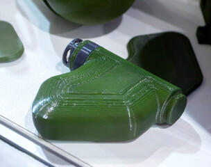 Mina Petal printed on 3D printer. Anti-personnel explosive mine created on 3D printer from molten plastic. Prototype of ammunition printed on 3D printer. Innovation modern new 3d printing technology