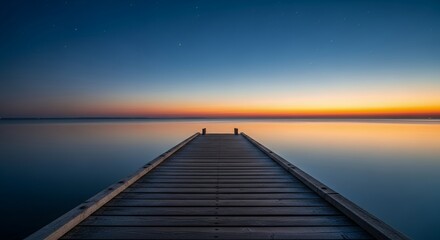 Serene Sunset over Calm Water with Wooden Pier Pathway