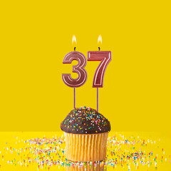 Birthday on a yellow background - Number 37 candle