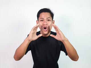 Asian man wearing a casual black shirt, shouting or calling enthusiastically, showing a cheerful...