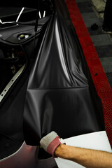 Careful application and tensioning of black vinyl avoids surface damage or bubbling. Matte black...