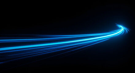 Captivating blue light trails on black background, showcasing dynamic movement