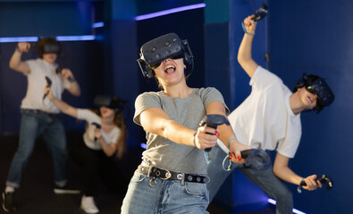 girl in virtual reality helmet crouches down and dodges flying asteroids during space adventure...
