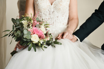Bridal bouquet with roses, lisianthus and eucalyptus