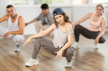Break dance performed by a group of young dancers in a dance studio