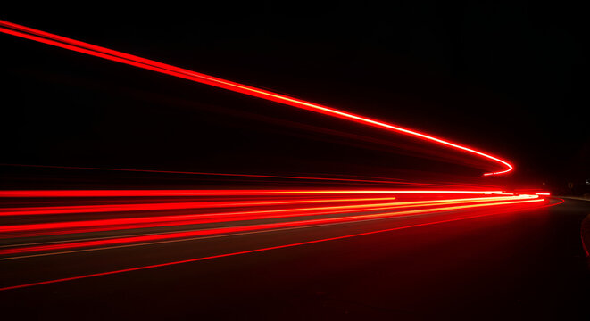 Abstract motion blur of red car lights on a dark night landscape scene - Powered by Adobe