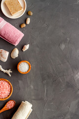Essential oil in bottles and spa cosmetics with towels, top view. Beauty spa therapy cosmetics and wellness flat lay