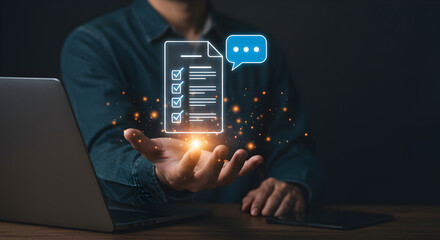 A man's hand interacts with a glowing digital document and chat bubble, symbolizing modern task management and communication.