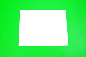 Plain white paper with green background, Blank space for advertising, banners, campaigns