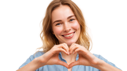 Smiling woman making a heart shape with her hands, expressing love and positivity.
