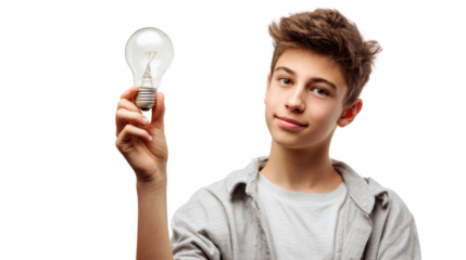 Young boy holding a light bulb with a thoughtful expression, isolated on white background.