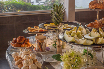 Breakfast buffet with fruits and pastries selection