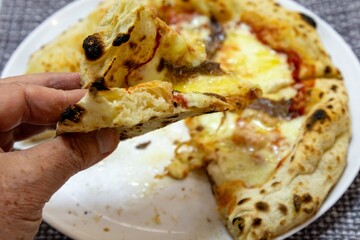 The most authentic Neapolitan pizza with anchovies, anchovies from the Mediterranean Sea, extra virgin olive oil and buffalo mozzarella cheese