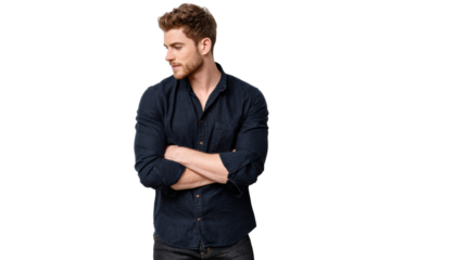 Confident young man in a navy shirt, standing with arms crossed, looking thoughtfully to the side.