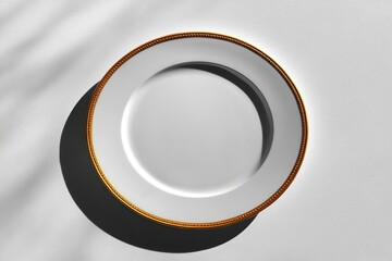 Elegant white plate with gold trim