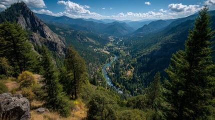Fototapeta premium Scenic Mountain Landscape with River Flowing Through Lush Green Valley