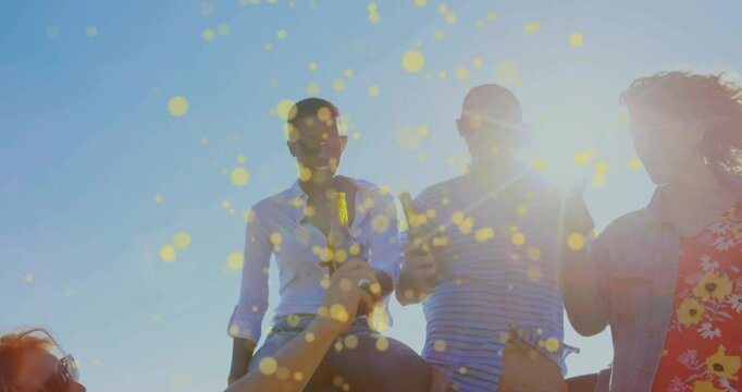 Opening tailgate friends grabbing beers from truck bed and toasting amid bokeh in lifestyle scene