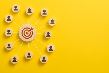 Fototapeta premium Connected team members collaboratively aiming for a central target, symbolizing shared goals and successful strategy on yellow.
