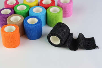 Different colors of cohesive bandages. Non adhesive bandage in a white background with different colors