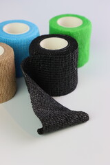 Different colors of cohesive bandages. Non adhesive bandage in a white background with different colors