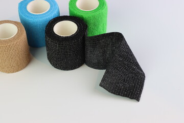 Different colors of cohesive bandages. Non adhesive bandage in a white background with different colors