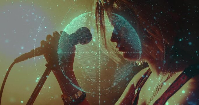Teenage singer adjusting mic stand, starting music performance with rotating holographic globe