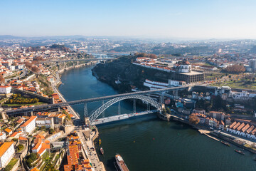 Naklejka premium Cityscape of the city of Porto, including the Douro river and the Dom Luis I bridge (Ponte de Dom Luís I). Porto, Portugal.