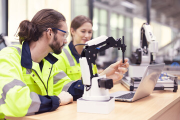 Team of engineers at conference project meeting room, discuss and  inspect robot AI mechanism, find...