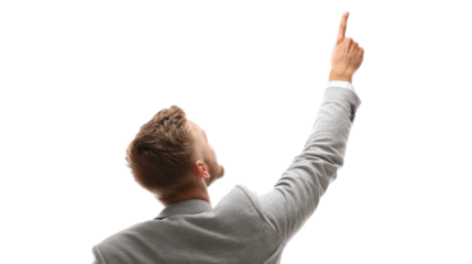 Businessman pointing upwards, symbolizing growth and success, isolated on white background.