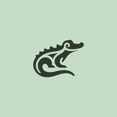 Crocodile logo in bold and clean silhouette design.