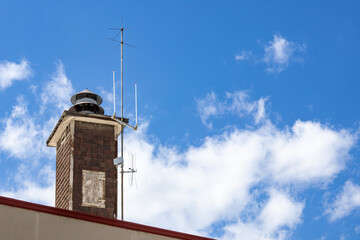 Rooftop chiminey and clouds