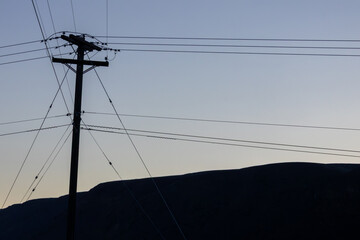 Phone lines criscross in the desert