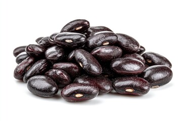 Obraz premium Pile of black beans showcasing their smooth dark surface with a small lightcolored hilum on some beans