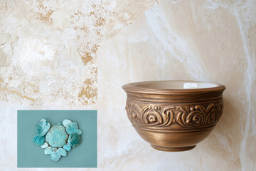 Ornate bronze pot with decorative stone arrangement on textured surface