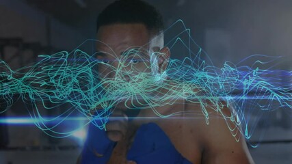 Boxer adjusting stance in ring causing teal waveform reacting with each jab for boxing training - Powered by Adobe