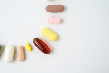 Clock made of pills capsules, pills form a circle, omega, vitamins, Cod liver oil, supplements