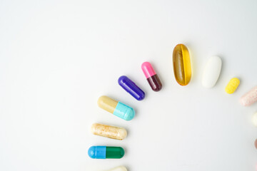 Clock made of pills capsules, pills form a circle, omega, vitamins, Cod liver oil, supplements