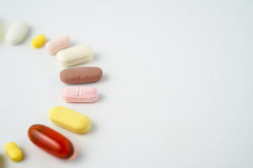 Clock made of pills capsules, pills form a circle, omega, vitamins, Cod liver oil, supplements