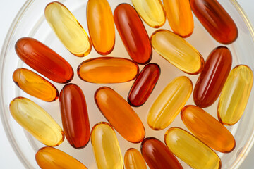 Vitamins capsules, fish oil, soft gels, supplements, omega 3, omega 9, vitamin D, vitamin E