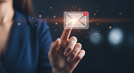 A womans finger touches a glowing email icon with a notification