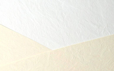 Obraz premium 白とベージュの和紙の背景素材 