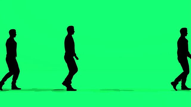 Silhouette of a man walking on a green screen, HD footage. - Powered by Adobe