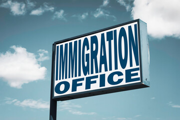 Obraz premium Immigration office sign with clouds