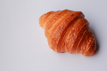  Closeup France croissant bread on white background, top view of healthy bakery with copy space