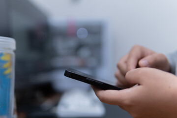 Close-up photograph of hands browsing a smartphone, photographic, modern lifestyle concept for technology blog or social media content