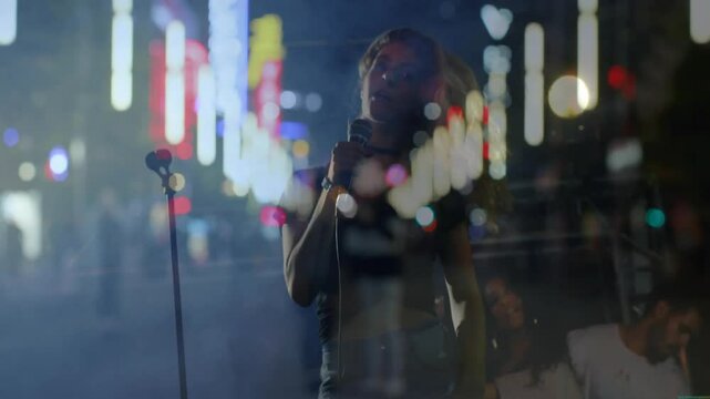 Street singer stepping up to mic, singing into microphone under neon lights for music show